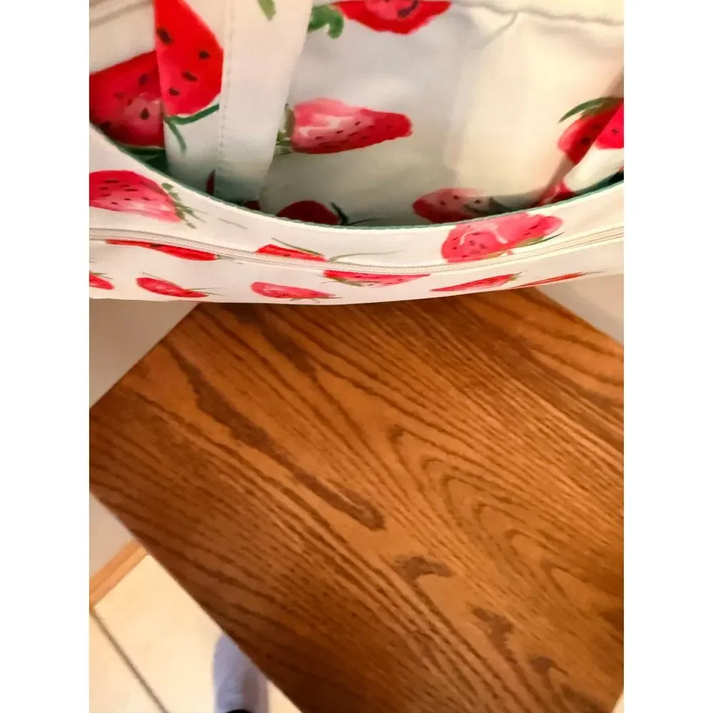 Canvaslove laptop sleeve features strawberry print, detachable shoulder strap